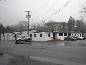 Commercial property inspected — small white commercial building 6